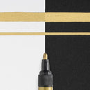 Line details of Sakura Pen Touch Gold 2mm Paint Pen on white and black paper