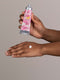 I?m A Delicate Fucking Flower Natural Hand Cream - Peony with A Pop of Geranium 2oz tube and lotion on woman's hand